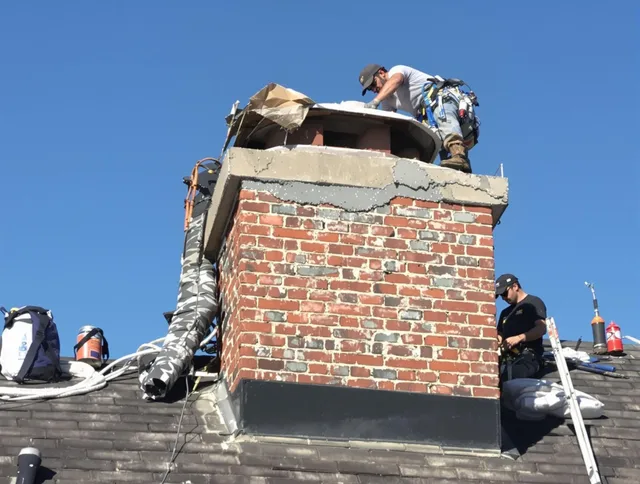 Garden City Chimney Sweep installing a custom chimney crown in Garden City, GA